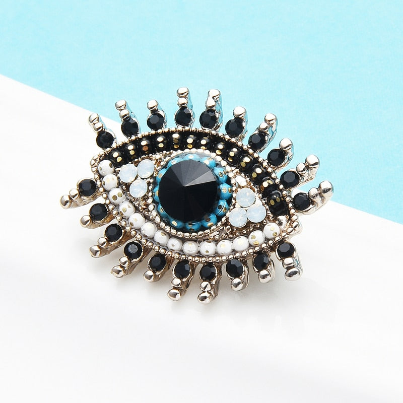 Wuli&baby Small Rhinestone Black Blue Eye Brooches Women Alloy Simulated Pearl Eye Collar Pins Gifts
